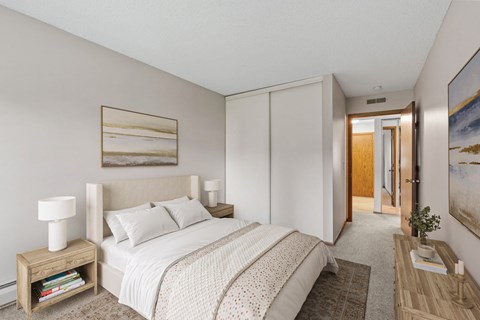 Bedroom in a renovated apartment home at Oakwood Apartments in Plymouth, MN  55447