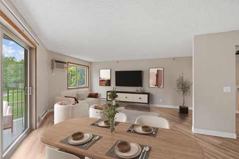 Kitchen, living room, and dining room in a newly renovated apartment home at Park Pointe Apartments in St. Louis Park, MN 55426