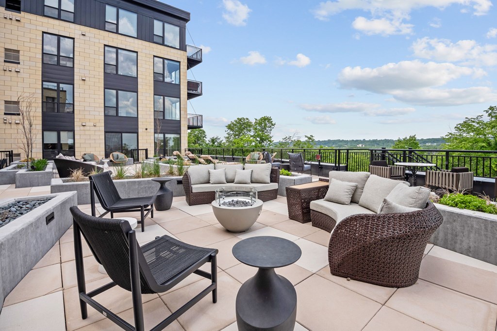 Zen Terrace with Lounge Chairs and Grills at Lilia Apartments in Lilydale, MN 55118
