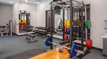 a gym with weights and other equipment in a building at Expo, Minneapolis, MN