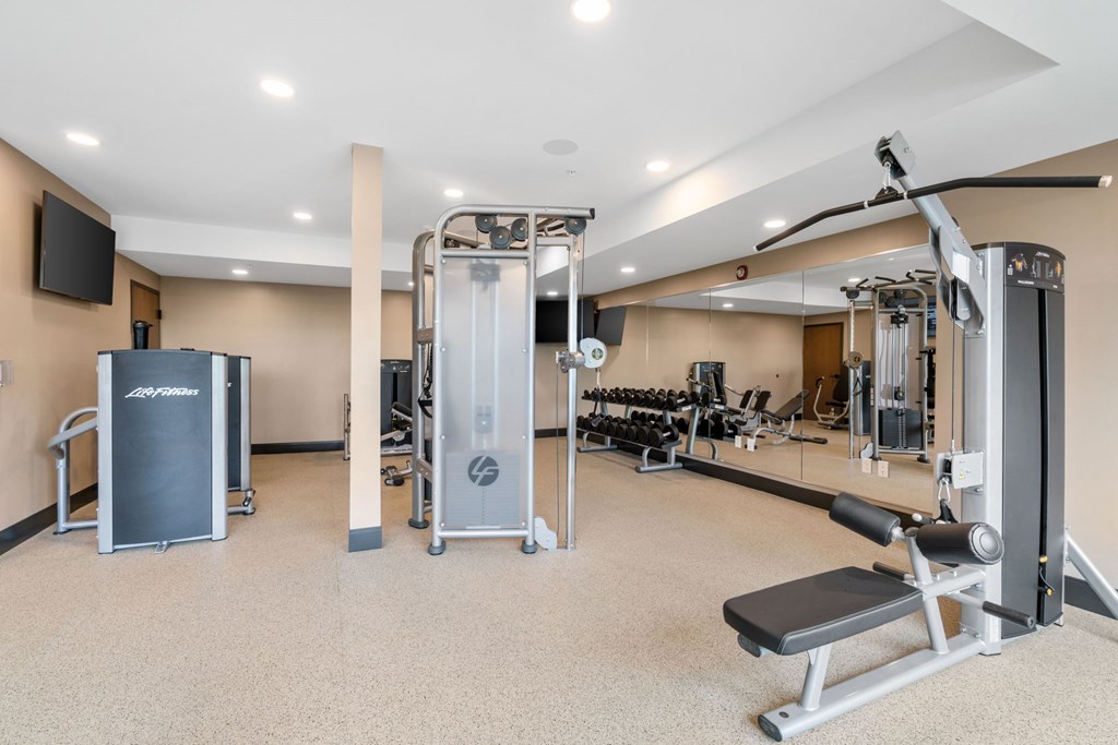 The resort-style luxury 24-hour fitness center at Lilia in Lilydale, MN 55118, with cardio equipment, free weights, and exercise machines.