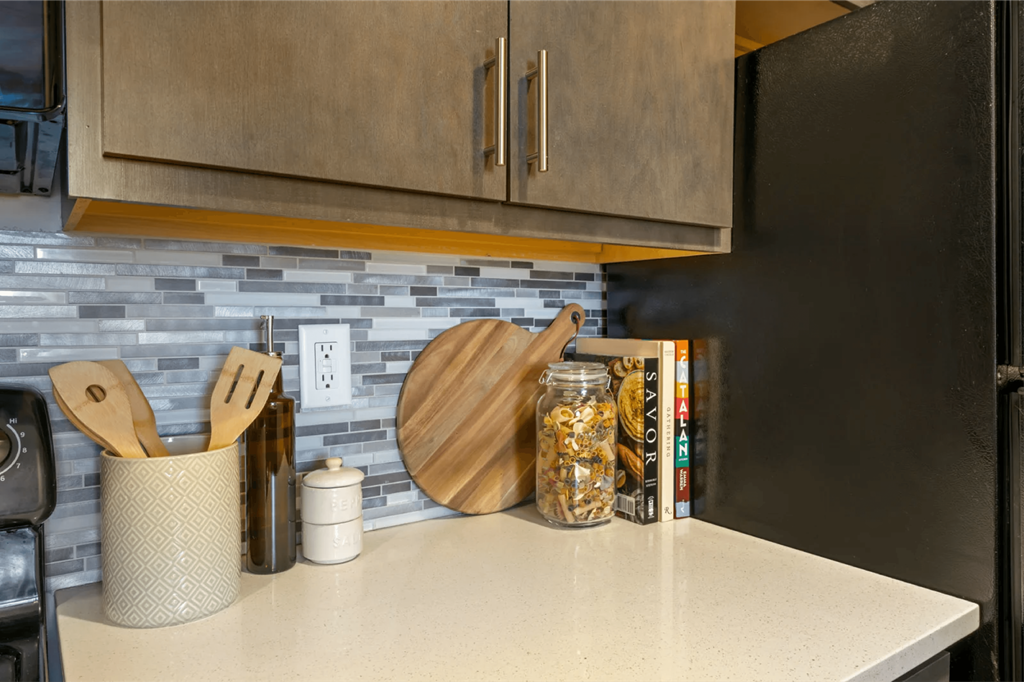 a kitchen with a counter top and a refrigerator  at The Cosmopolitan, St Paul