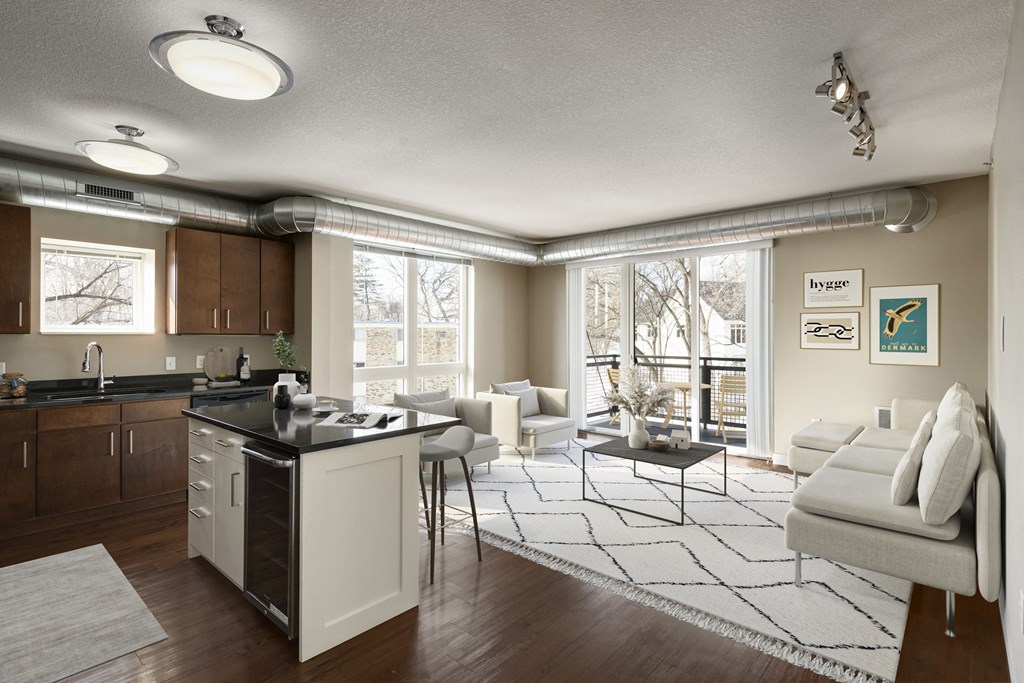 a kitchen and living room in a 555 waverly unit at Be @ Axon Green, Minneapolis, MN