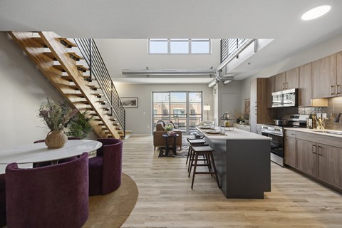 A modern kitchen with a dining table and chairs.