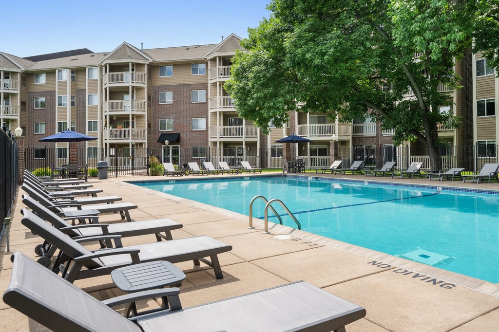 our apartments offer a swimming pool with lounge chairs at Cityscape, St Louis Park, MN