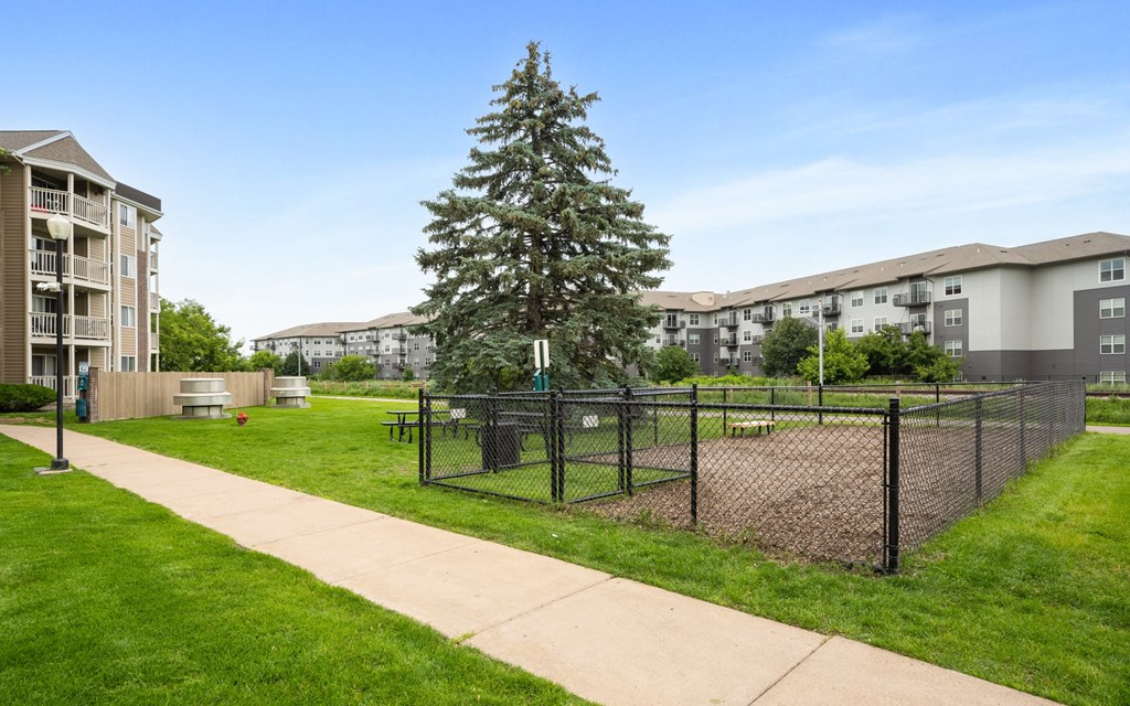 the preserve at ballantyne commons tennis courts with apartments in the background at Cityscape, St Louis Park, 55416