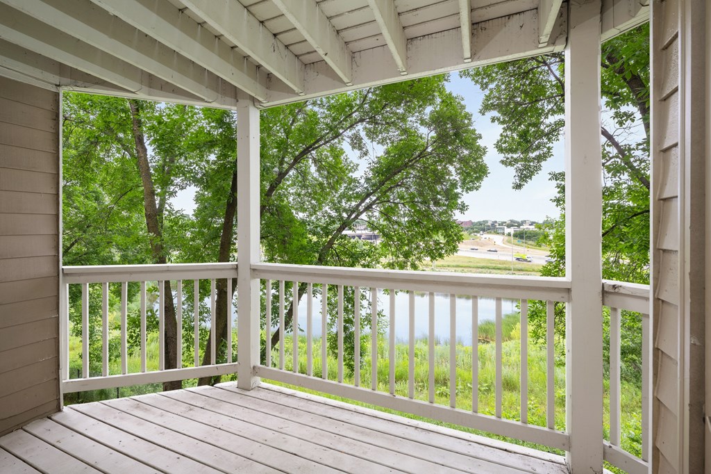 the view from the porch of a house overlooking a lake at Cityscape, St Louis Park, MN, 55416