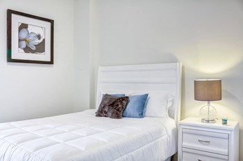 Bedroom with Comfy bed Bedroom with Comfy bed at Central Park West, St. Louis Park, MN, 55416 - Photo Gallery 5