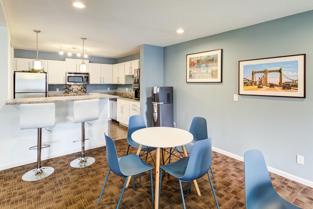a dining room with a kitchen with a table and chairs at Cityscape, St Louis Park, Minnesota