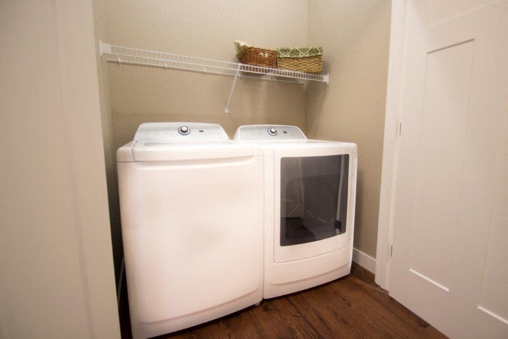 a washer and dryer in a small laundry room