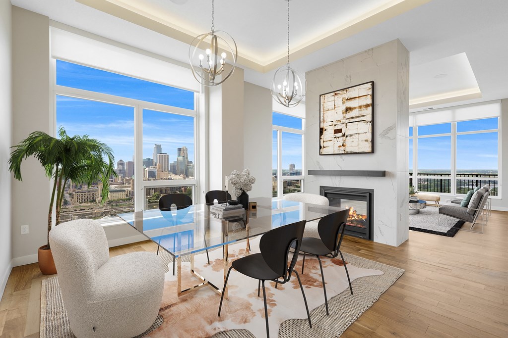 a dining room with a glass table and chairs and a fireplace at Expo, Minneapolis Minnesota