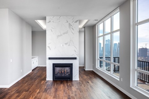 a living room with a fireplace and a large window at Expo, Minneapolis, MN 55414