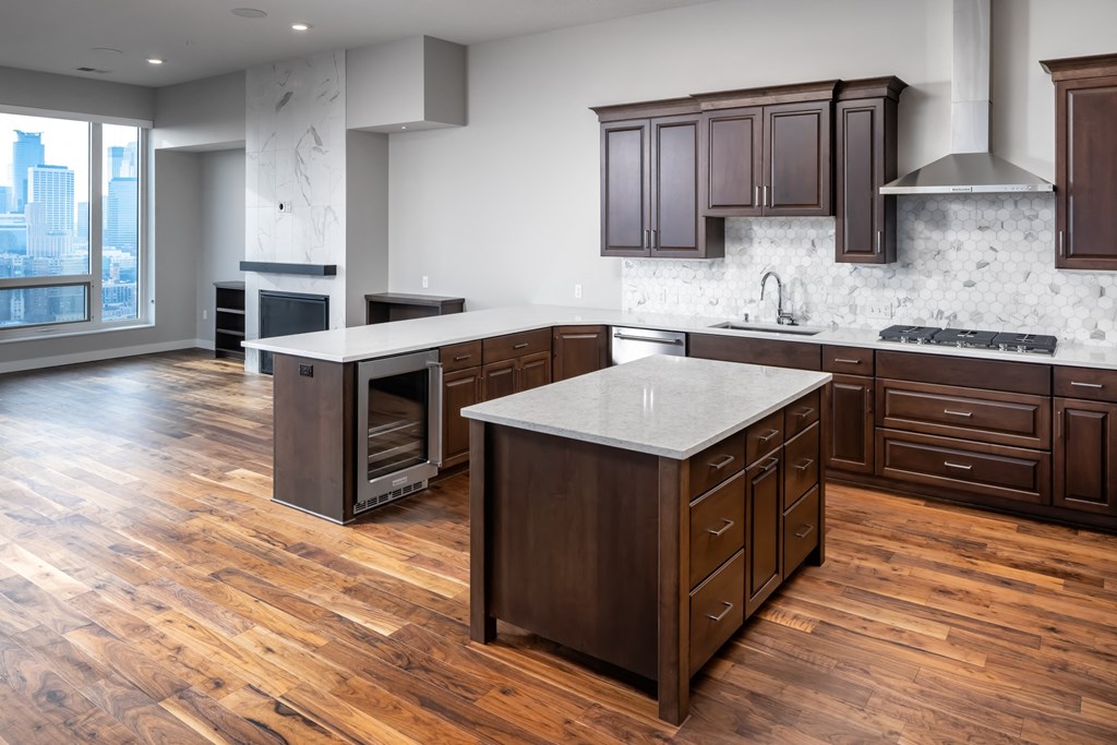 a large kitchen with wooden floors and wooden cabinets at Expo, Minneapolis Minnesota