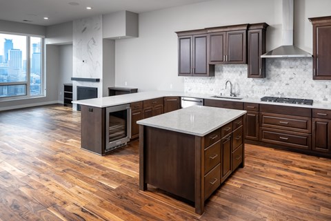 a large kitchen with wooden floors and wooden cabinets at Expo, Minneapolis Minnesota