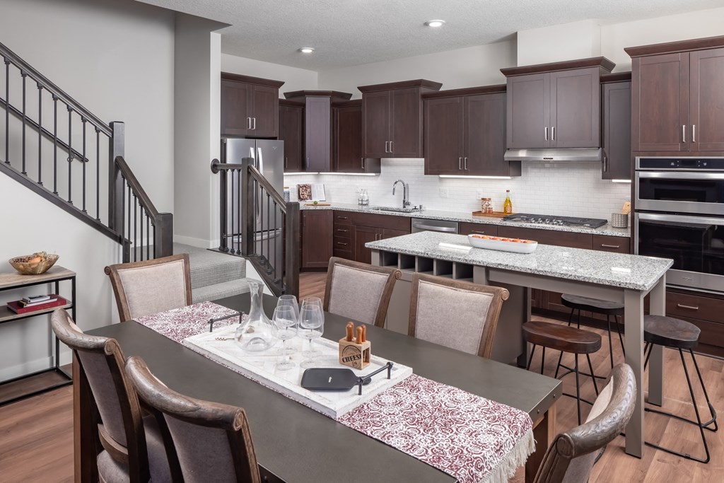 a kitchen and dining area with a table and chairs at Expo, Minneapolis Minnesota