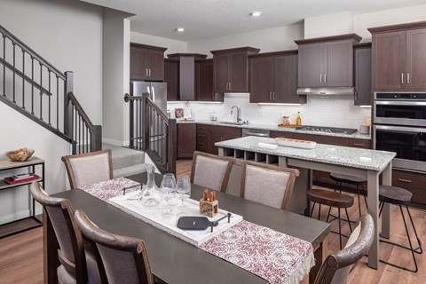 a kitchen and dining area with a table and chairs at Expo, Minneapolis Minnesota