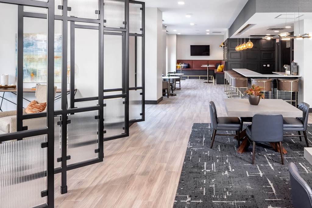 a conference room with tables and chairs and a glass door at Expo, Minneapolis, 55414