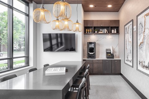 a kitchen with a long table and chairs and a large window at Expo, Minnesota