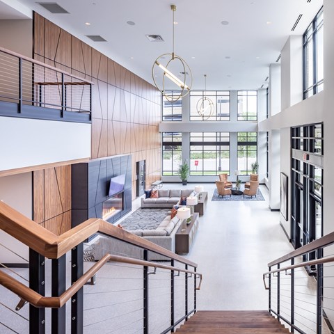 the lobby of an office building with stairs and couches at Expo, Minneapolis, MN 55414