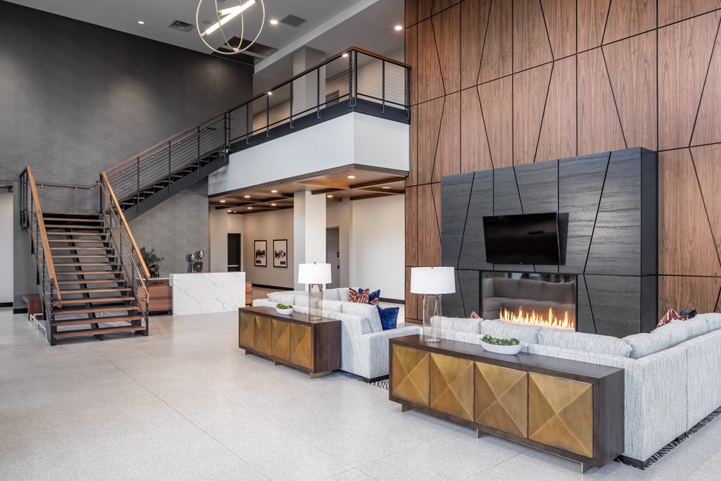 a living room with couches and a fireplace at Expo, Minneapolis, MN 55414