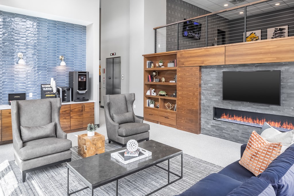 a living room with a fireplace and a tv at Expo, Minneapolis Minnesota