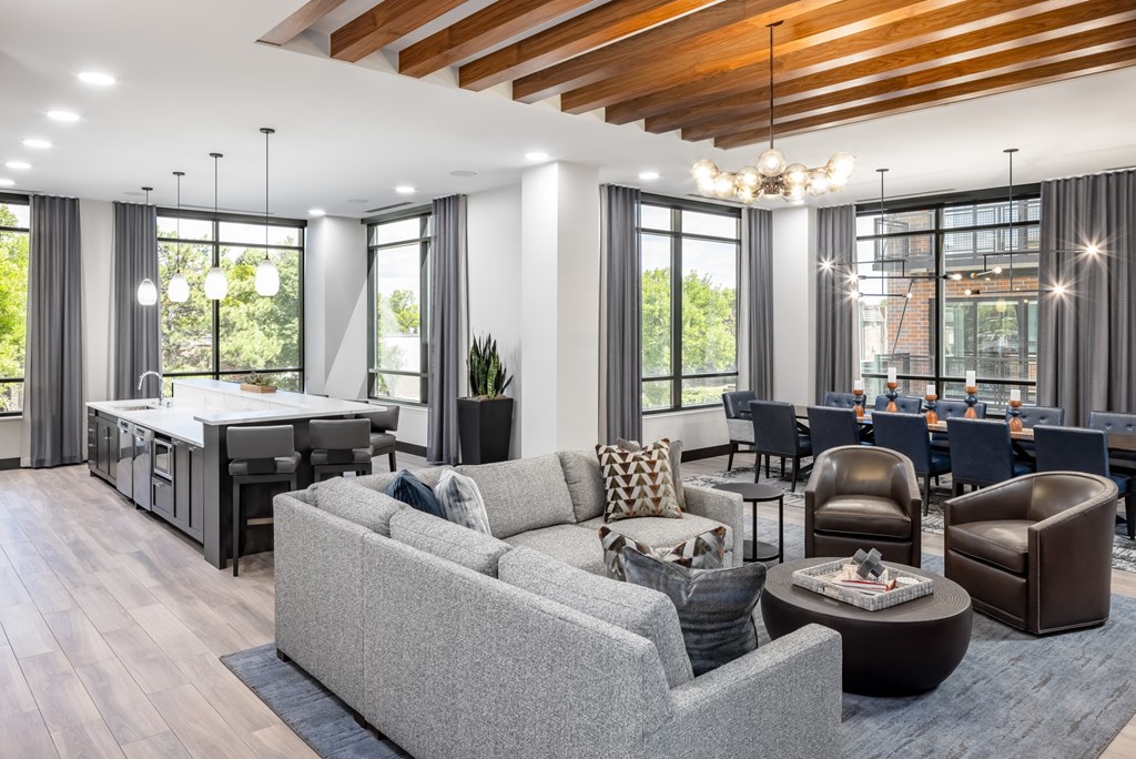 a living room with couches and chairs and a bar and a dining room at Expo, Minneapolis, 55414