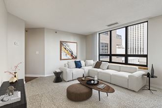 Living room with couch at Galtier Towers Apartments, St. Paul, MN