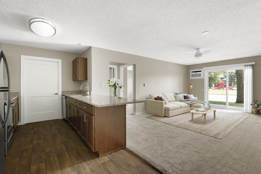 a living room with a kitchen and a couch