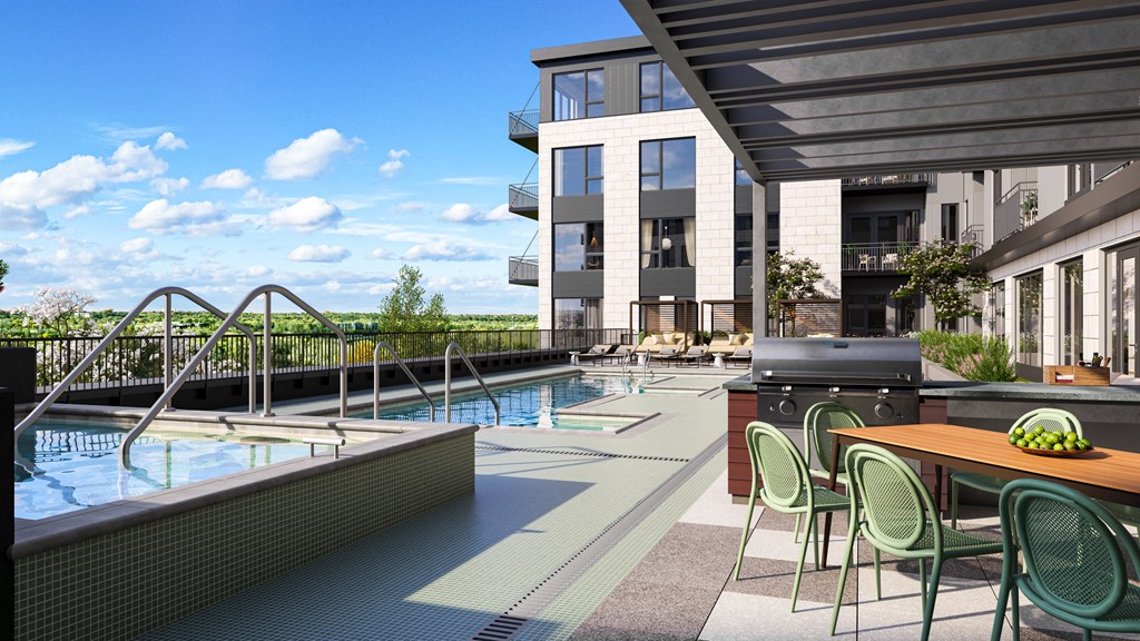 a pool and dining area with a building in the background at Lilia, Lilydale, MN, 55118