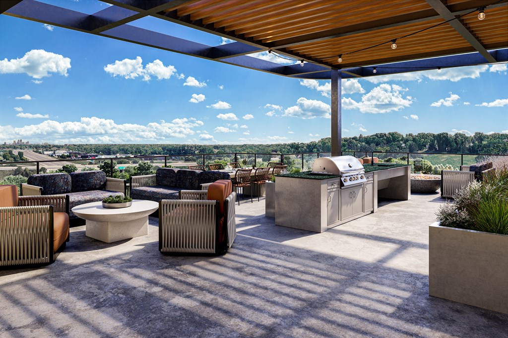 a patio with furniture and a grill and a roof at The Mera, St Louis Park Minnesota
