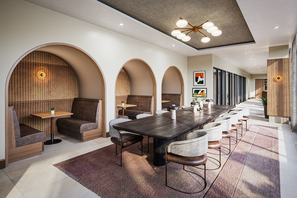 a long dining room with a long table and chairs at The Mera, St Louis Park