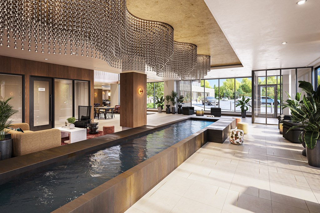 the lobby of a hotel with a swimming pool at The Mera, St Louis Park, MN