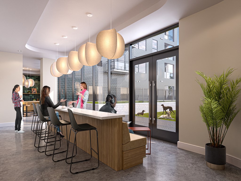 a group of people are standing around a counter in a lobby at The Mera, Minnesota, 55426?