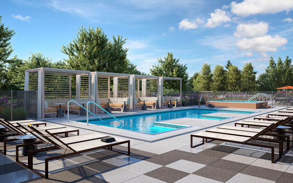 a swimming pool with chaise lounges and chairs at a resort at The Mera, St Louis Park