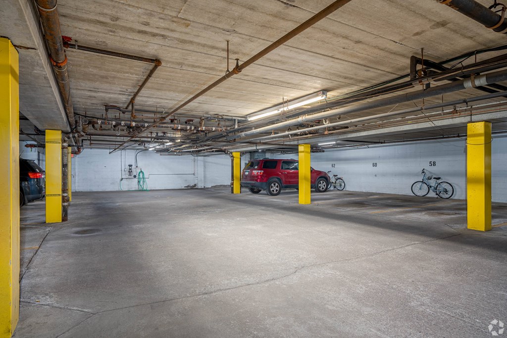 an empty parking garage with cars and bikes in it at Park Pointe, Minnesota