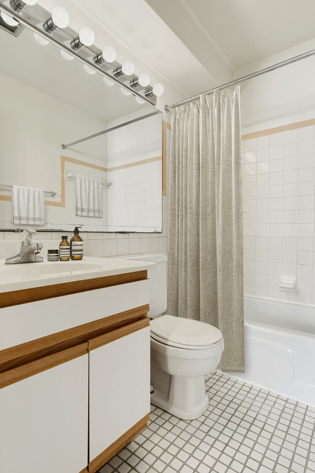 a bathroom with a toilet and a shower and a sink