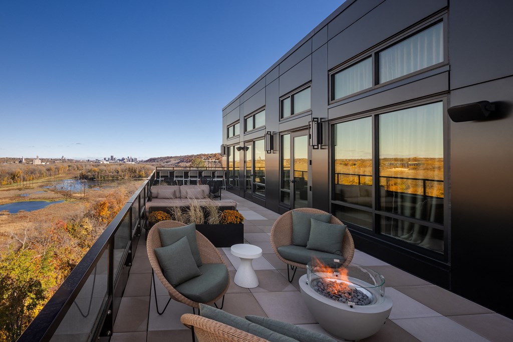 Top floor terrace with seating and fire pits leading from the Parlour and the Tea Room at Lilia in Lilydale, 55118