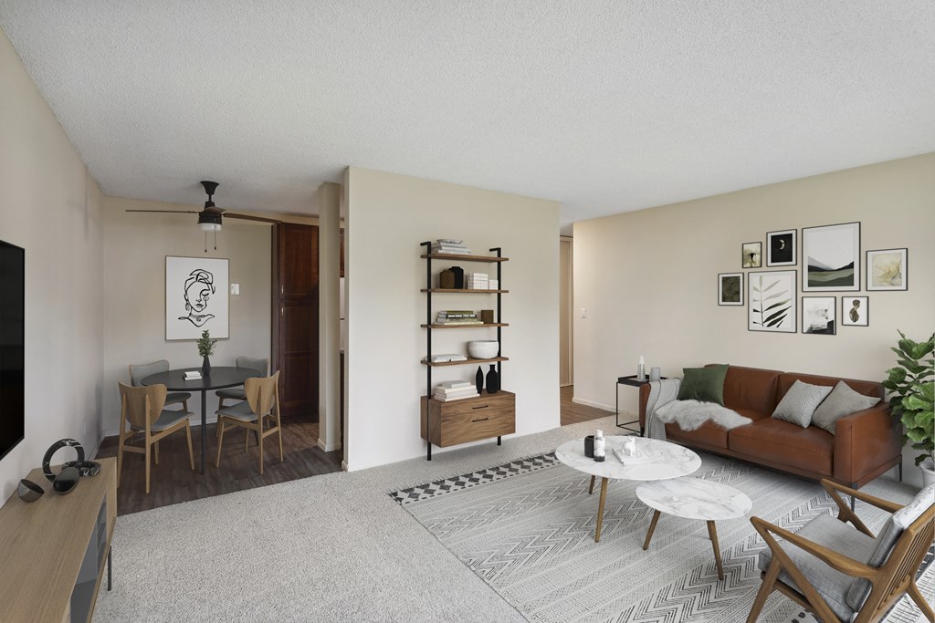 a living room and dining room with a couch and a table