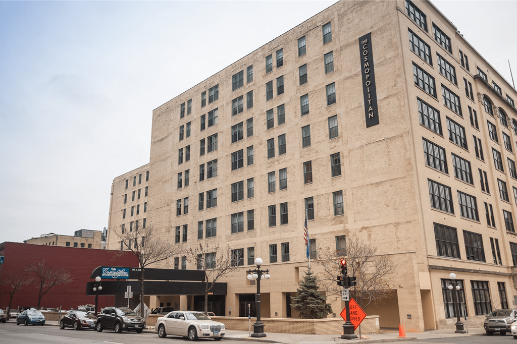 a large building on the corner of a city street  at The Cosmopolitan, St Paul, Minnesota