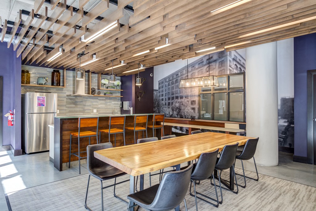 a dining room with a wooden table and chairs  at The Cosmopolitan, Minnesota, 55101