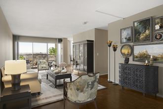 a living room filled with furniture and a large window