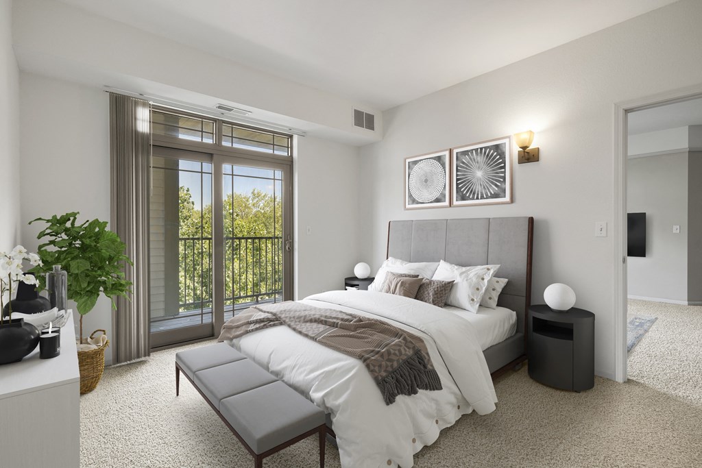 a bedroom with a large bed and a window