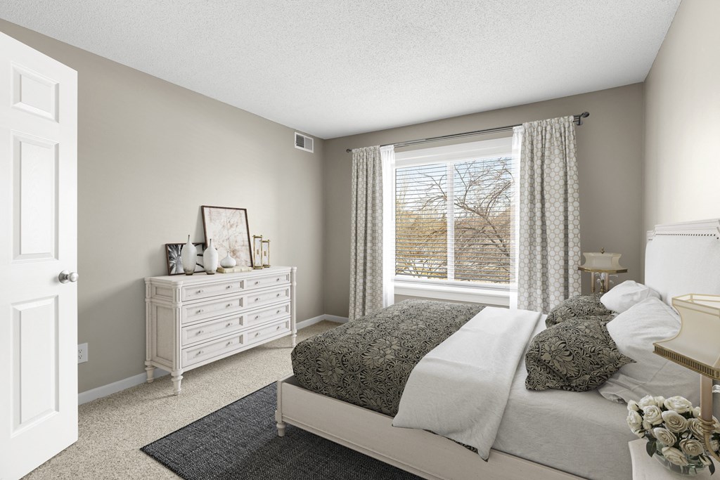Cozy bed in bedroom at The Riverwood, Minnesota