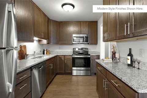 a kitchen with wooden cabinets and granite counter tops and stainless steel appliances