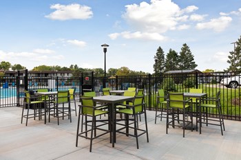 Hightop tables outside Villages on McKnight Apartments - Photo Gallery 34