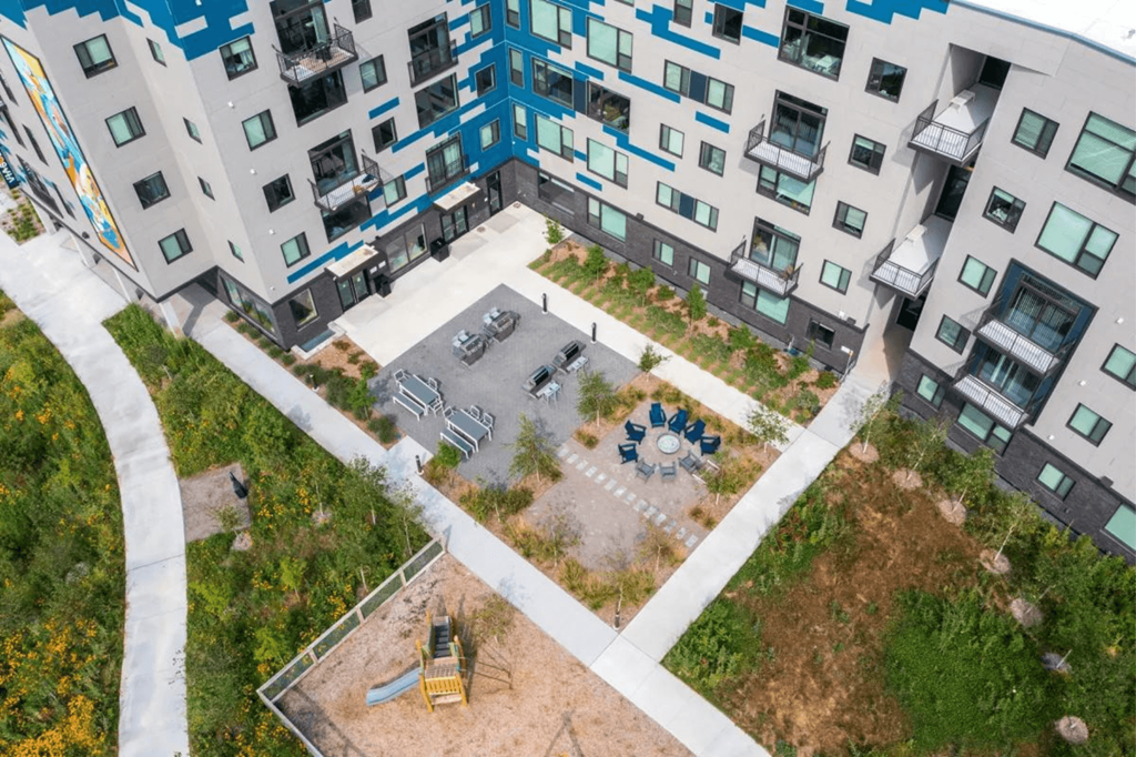 an aerial view of an apartment building with a courtyard at Zelia on Seven, Minnesota, 55416