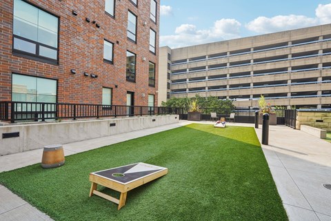 Cornhole boards on a large patch of turf