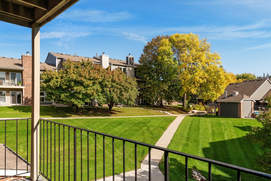 Balcony overlooking the grounds and walking paths at Eden Commons in Eden Prairie, MN 55