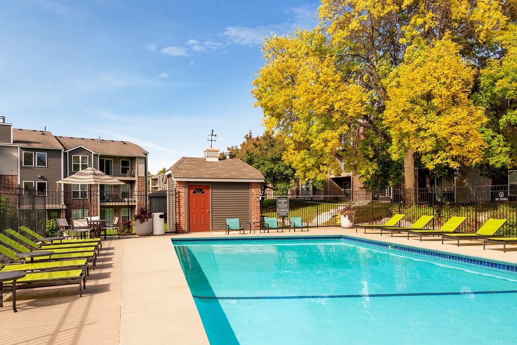 Outdoor pool with lounge chairs at Eden Commons in Eden Prairie, MN 55344