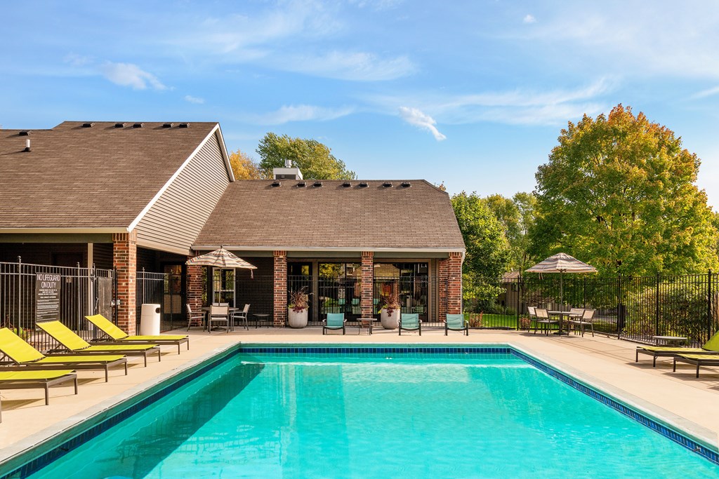Outdoor pool with lounge chairs at Eden Commons in Eden Prairie, MN 55344